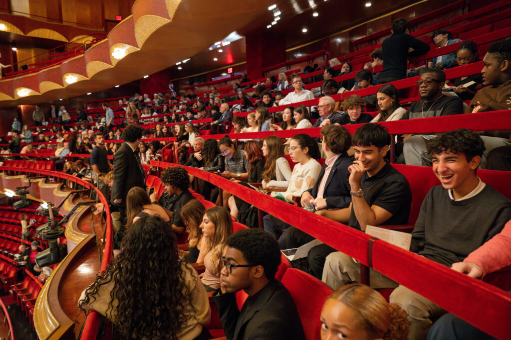 Students seated in theater of Met Opera