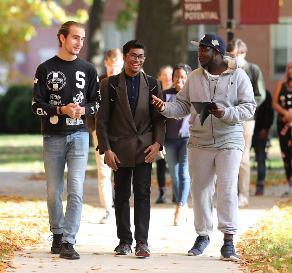 Three students walking on Earlham College campus